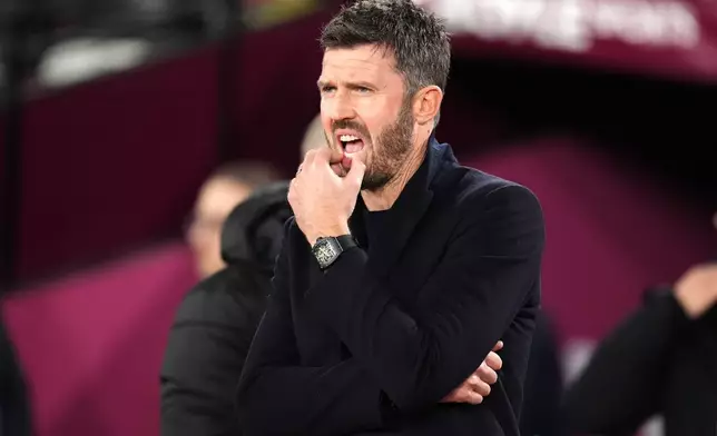 Manchester United manager Michael Carrick watches before a Premier League soccer match against West Ham United, Tuesday, Feb. 10, 2026, in London. (Adam Davy/PA via AP)