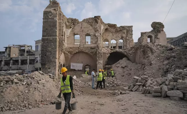 FILE - Workers carry out recovery projects and search for missing artifacts at the Pasha Palace in Gaza City after an Israeli strike damaged it during the war with Hamas, Thursday, Nov. 13, 2025. (AP Photo/Jehad Alshrafi, File)