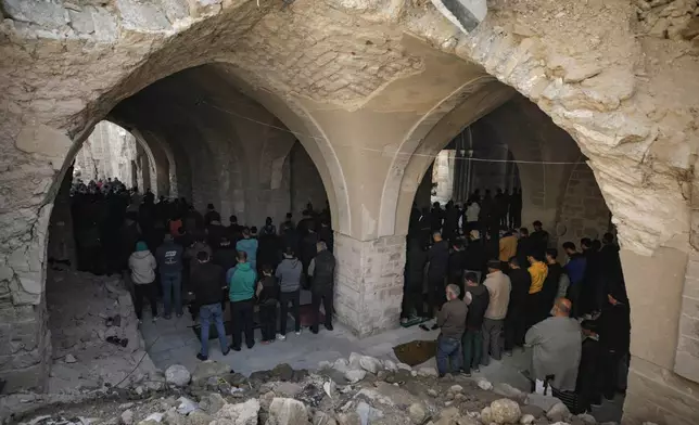 FILE - Palestinians attend Friday prayers at the Great Omari Mosque in Gaza City after it was damaged by an Israeli strike during the war with Hamas, Friday, Nov. 7, 2025. (AP Photo/Jehad Alshrafi, File)