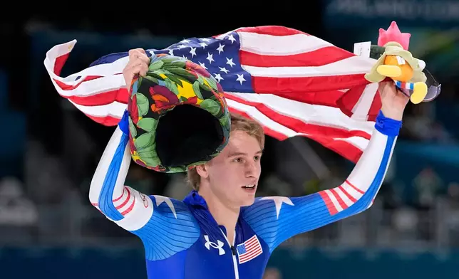 Gold medallist Jordan Stolz of the U.S. celebrates after the men's 1,000 meters speedskating race at the 2026 Winter Olympics, in Milan, Italy, Wednesday, Feb. 11, 2026. (AP Photo/Ben Curtis)