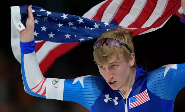 Gold medallist Jordan Stolz of the U.S. celebrates after the men's 1,000 meters speedskating race at the 2026 Winter Olympics, in Milan, Italy, Wednesday, Feb. 11, 2026. (AP Photo/Luca Bruno)
