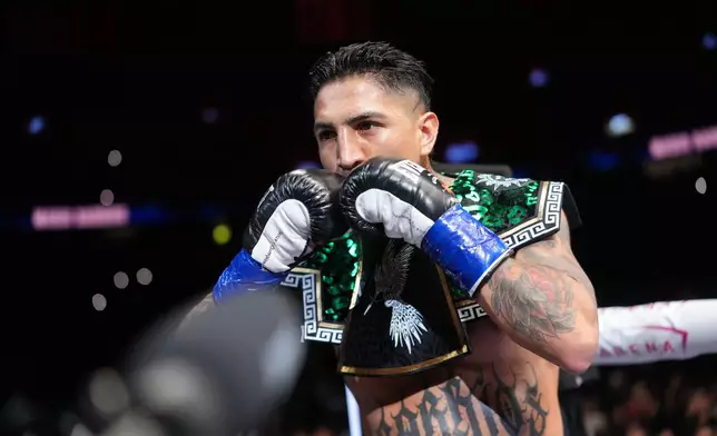 Mario Barrios arrives to fight in a WBC welterweight title boxing match against Ryan Garcia Saturday, Feb. 21, 2026, in Las Vegas. (AP Photo/Lucas Peltier)