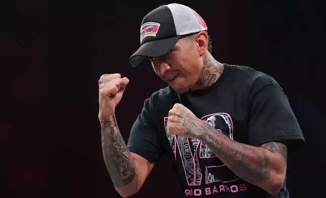 FILE - Mario Barrios works out ahead of his WBC welterweight world title bout against Abel Ramos during the Mike Tyson vs. Jake Paul undercard, Nov. 12, 2024, in Irving, Texas. (AP Photo/Julio Cortez, File)