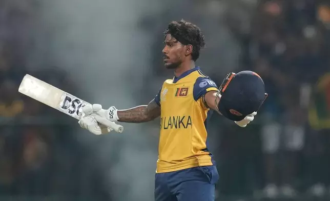 Sri Lanka's Pathum Nissanka celebrates his century during the T20 World Cup cricket match between Sri Lanka and Australia in Pallekele, Sri Lanka, Monday, Feb. 16, 2026. (AP Photo/ Eranga Jayawardena)