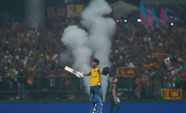 Sri Lanka's Pathum Nissanka celebrates his century during the T20 World Cup cricket match between Sri Lanka and Australia in Pallekele, Sri Lanka, Monday, Feb. 16, 2026. (AP Photo/ Eranga Jayawardena)