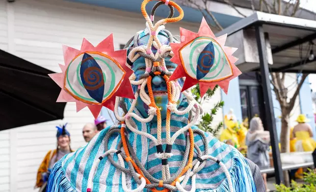 Attendees march during the annual Society of Saint Anne parade on Mardi Gras Day, Tuesday, Feb. 17, 2026, in New Orleans. (Photo by Amy Harris/Invision/AP)