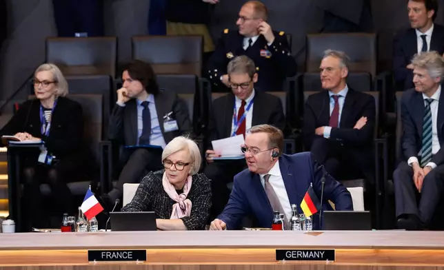 Germany's Defense Minister Boris Pistorius, right, speaks with French Defense Minister Catherine Vautrin during a meeting of the North Atlantic Council in Defense Ministers Session at NATO headquarters in Brussels, Thursday, Feb. 12, 2026. (AP Photo/Geert Vanden Wijngaert)