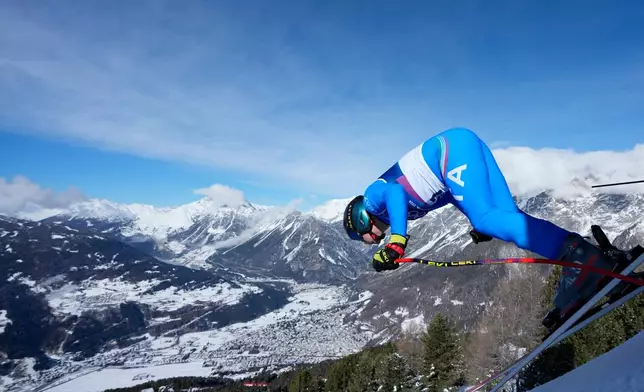 Italy's Giovanni Franzoni starts an alpine ski, men's downhill official training, at the 2026 Winter Olympics, in Bormio, Italy, Thursday, Feb. 5, 2026. (AP Photo/Julia Demaree Nikhinson)