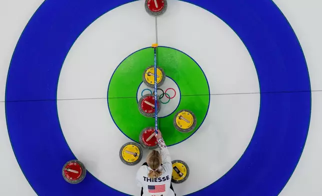 United States' Cory Thiesse competes against Norway during the mixed doubles round robin session 2 of the curling competition at the 2026 Winter Olympics, in Cortina d'Ampezzo, Italy, Thursday, Feb. 5, 2026. (AP Photo/Christophe Ena)