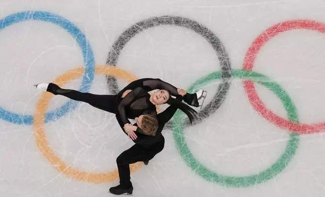 Lithuania's Allison Reed and Saulius Ambrulevicius skate during a figure skating practice session at the 2026 Winter Olympics, in Milan, Italy, Thursday, Feb. 5, 2026. (AP Photo/Bernat Armangue)