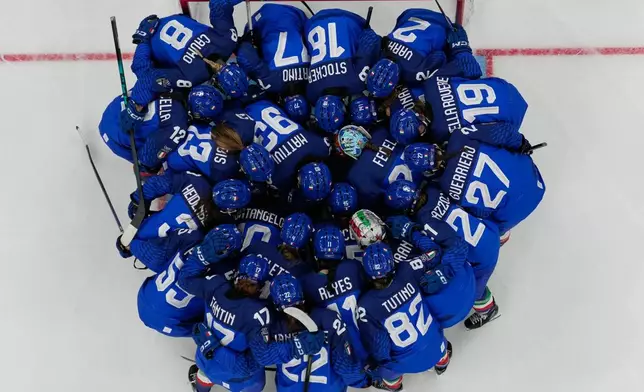 Italy players before during a preliminary round match of women's ice hockey between Italy and France at the 2026 Winter Olympics, in Milan, Italy, Thursday, Feb. 5, 2026. (AP Photo/Carolyn Kaster)
