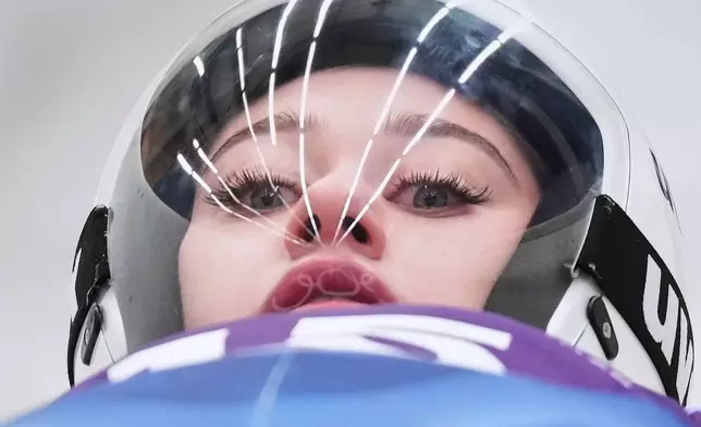 Individual Neutral Athlete Daria Olesik starts for a women's Luge training session at the 2026 Winter Olympics, in Cortina d'Ampezzo, Italy, Thursday, Feb. 5, 2026. (AP Photo/Alessandra Tarantino)