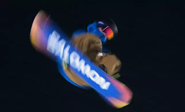 Germany's Noah Vicktor practices during a snowboard big air training session at the 2026 Winter Olympics, in Livigno, Italy, Wednesday, Feb. 4, 2026. (AP Photo/Gregory Bull)