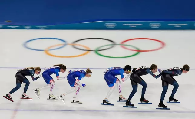 United States' women's and men's team pursuit speed skaters warm up, at the 2026 Winter Olympics, in Milan, Italy, Thursday, Feb. 5, 2026. (AP Photo/Luca Bruno)