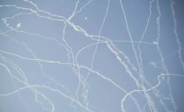 FILE - Israeli air defense system fires to intercept missiles during an Iranian attack over Tel Aviv, Israel, Thursday, June 19, 2025. (AP Photo/Leo Correa, File)