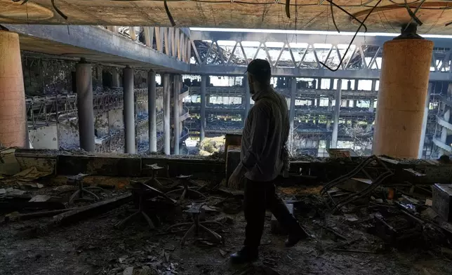 FILE - A man walks in the damaged headquarters of Islamic Republic of Iran Broadcasting, Iranian state television, in Tehran, Iran, Thursday, June 19, 2025. (AP Photo/Vahid Salemi, File)