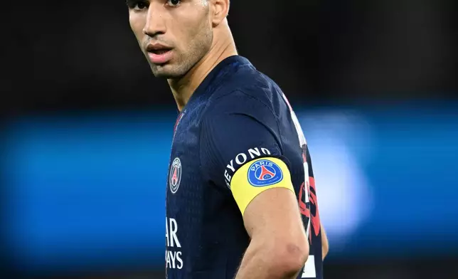 PSG's Achraf Hakimi reacts during the French League One soccer match between Paris Saint-Germain and Metz in Paris, France, Saturday, Feb. 21, 2026. (AP Photo/Emma Da Silva)