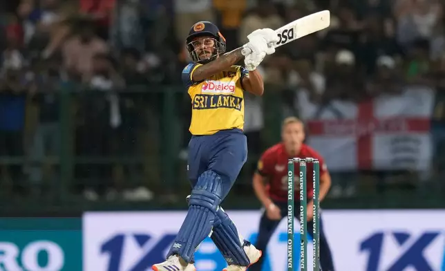Sri Lanka's Pathum Nissanka, center, plays a shot during the third T20 cricket match between England and Sri Lanka in Pallekele, Sri Lanka, Tuesday, Feb, 3. 2026. (AP Photo/Eranga Jayawardena)