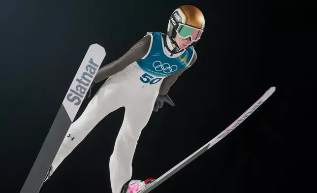 Nika Prevc, of Slovenia, soars through the air during her first round jump of the ski jumping women's large hill individual at the 2026 Winter Olympics, in Predazzo, Italy, Sunday, Feb. 15, 2026. (AP Photo/Evgeniy Maloletka)