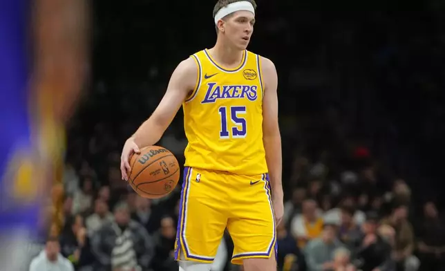 Los Angeles Lakers' Austin Reaves (15) looks to pass during the first half of an NBA basketball game against the Brooklyn Nets Tuesday, Feb. 3, 2026, in New York. (AP Photo/Frank Franklin II)
