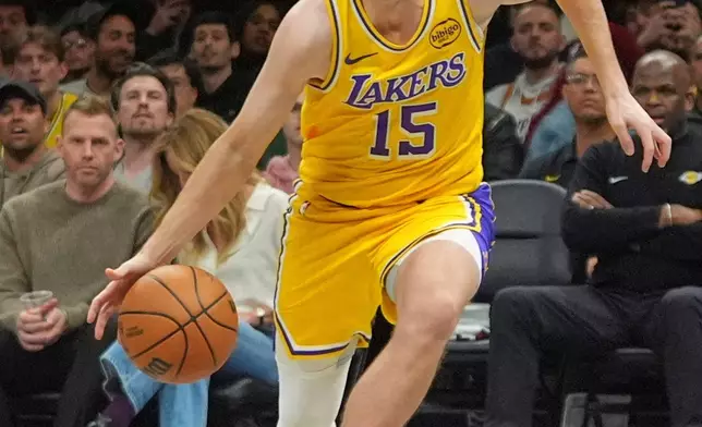 Los Angeles Lakers' Austin Reaves (15) drives to the basket during the first half of an NBA basketball game against the Brooklyn Nets Tuesday, Feb. 3, 2026, in New York. (AP Photo/Frank Franklin II)