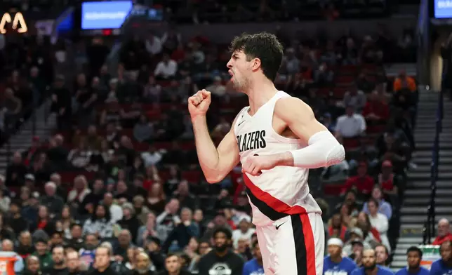 Portland Trail Blazers forward Deni Avdija reacts after scoring against the Philadelphia 76ers during the second half of an NBA basketball game, Monday, Feb. 9, 2026, in Portland, Ore. (AP Photo/Amanda Loman)