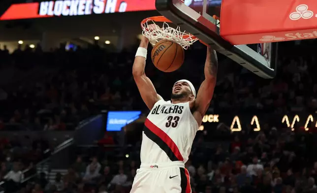 Portland Trail Blazers forward Toumani Camara dunks against the Philadelphia 76ers during the second half of an NBA basketball game, Monday, Feb. 9, 2026, in Portland, Ore. (AP Photo/Amanda Loman)