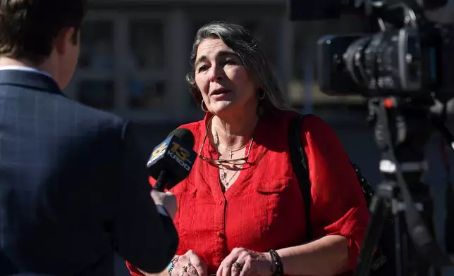 Angelika Stedman, who hired Return to Nature funeral home to cremate her daughter, speaks to a reporter outside of the El Paso County Courthouse in Colorado Springs, Colo., Friday, Feb. 6, 2026, ahead of the sentencing owner Jon Hallford. (AP Photo/Thomas Peipert)