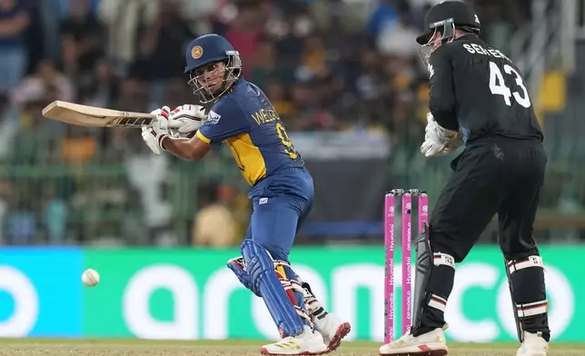 Sri Lanka's Dunith Wellalage plays a shot during the T20 World Cup cricket match between Sri Lanka and New Zealand in Colombo, Sri Lanka, Wednesday, Feb. 25, 2026. (AP Photo/Eranga Jayawardena)