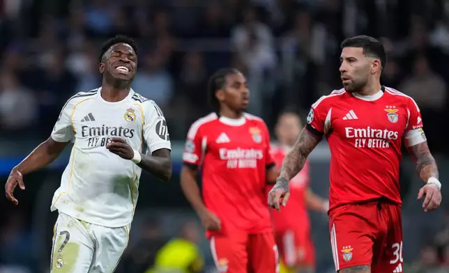 Real Madrid's Vinicius Junior, left, reacts after missing a chance to score during the second leg of the Champions League playoff soccer match between Real Madrid and Benfica in Madrid, Spain, Wednesday, Feb. 25, 2026. (AP Photo/Manu Fernandez)