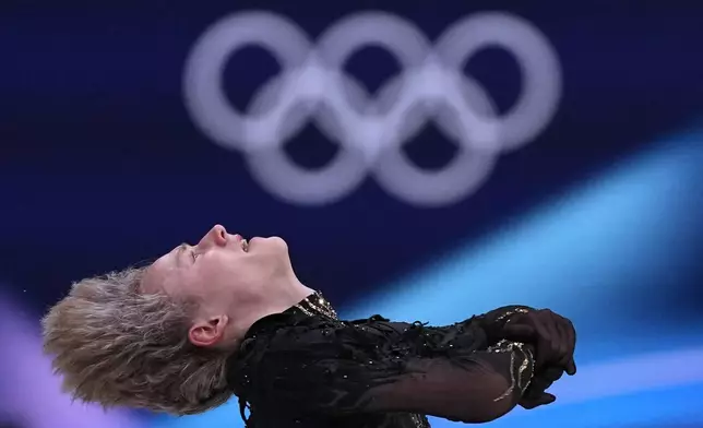 Ilia Malinin of the United States competes during the figure skating men's team event at the 2026 Winter Olympics, in Milan, Italy, Sunday, Feb. 8, 2026. (AP Photo/Stephanie Scarbrough)