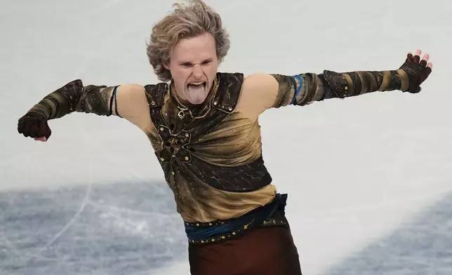 Ilia Malinin of the United States competes during the men's figure skating short program at the 2026 Winter Olympics, in Milan, Italy, Tuesday, Feb. 10, 2026. (AP Photo/Stephanie Scarbrough)