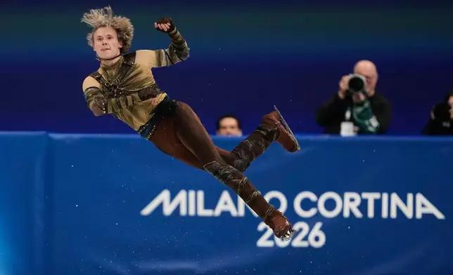 Ilia Malinin of the United States competes during the men's figure skating short program at the 2026 Winter Olympics, in Milan, Italy, Tuesday, Feb. 10, 2026. (AP Photo/Ashley Landis)