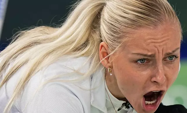Estonia's Marie Kaldvee yells during the mixed doubles round robin phase of the curling competition against Britain, at the 2026 Winter Olympics, in Cortina d'Ampezzo, Italy, Thursday, Feb. 5, 2026. (AP Photo/Fatima Shbair)