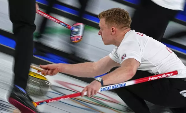 Britain's Bobby Lammie in action during the men's curling round robin session against Canada at the 2026 Winter Olympics, in Cortina d'Ampezzo, Italy, Tuesday, Feb. 17, 2026. (AP Photo/Fatima Shbair)