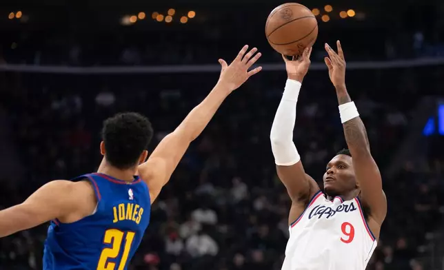 Los Angeles Clippers guard Bennedict Mathurin (9) shoots over Denver Nuggets forward Spencer Jones (21) during the first half of an NBA basketball game Thursday, Feb. 19, 2026, in Inglewood, Calif. (AP Photo/Kyusung Gong)