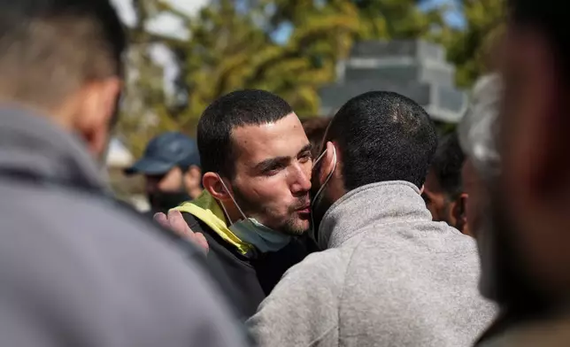 Two Syrian government prisoners embrace after being released in a prisoner exchange between Syrian government forces and Druze militiamen in Sweida province, Syria, Thursday, Feb. 26, 2026. (AP Photo/Ghaith Alsayed)