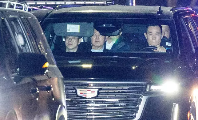 FILE - Impeached South Korean President Yoon Suk Yeol, center, sits in a car as he heads to a detention center in Uiwang, South Korea, on Jan. 15, 2025. (Kim Sung-min/Yonhap via AP, File)