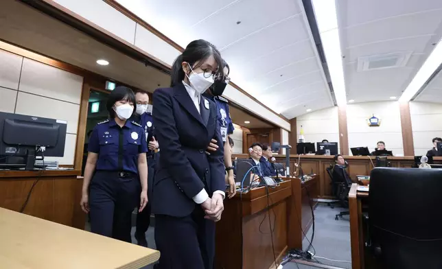 FILE - Kim Keon Hee, the wife of South Korea's jailed former President Yoon Suk Yeol, arrives for her first trial hearing on corruption charges at a courtroom of the Seoul Central District, Sept. 24, 2025 in Seoul, South Korea. (Chung Sung-Jun/Pool Photo via AP, File)