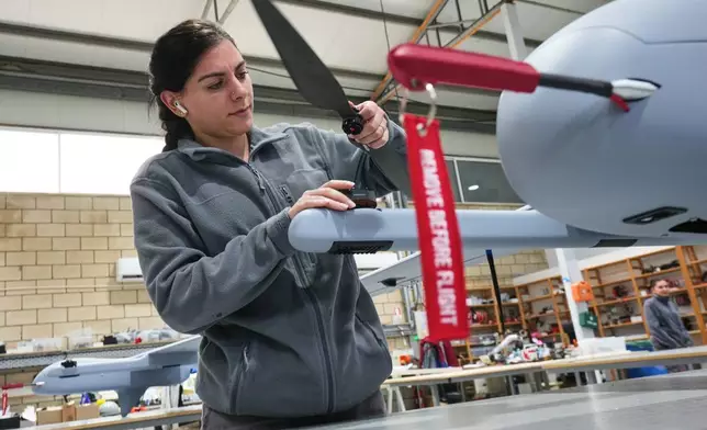 An employee works on an under-construction drone at a manufacturing factory in Limassol, Cyprus, Tuesday, Jan. 27, 2026. (AP Photo/Petros Karadjias)