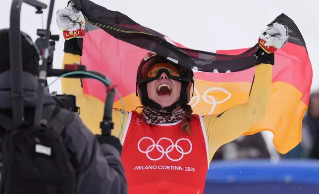 Gold medalist Germany's Daniela Maier (1) celebrates after competing in the women's ski cross finals at the 2026 Winter Olympics, in Livigno, Italy, Friday, Feb. 20, 2026. (AP Photo/Rebecca Blackwell)