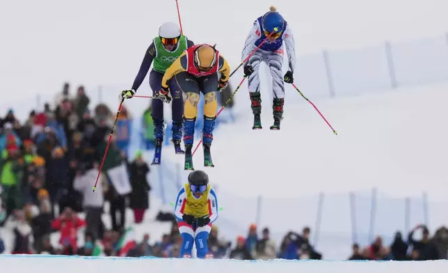 From left, Sweden's Sandra Naeslund (2), Germany's Daniela Maier (1) and Switzerland's Fanny Smith (3) compete during the women's ski cross finals at the 2026 Winter Olympics, in Livigno, Italy, Friday, Feb. 20, 2026. (AP Photo/Rebecca Blackwell)