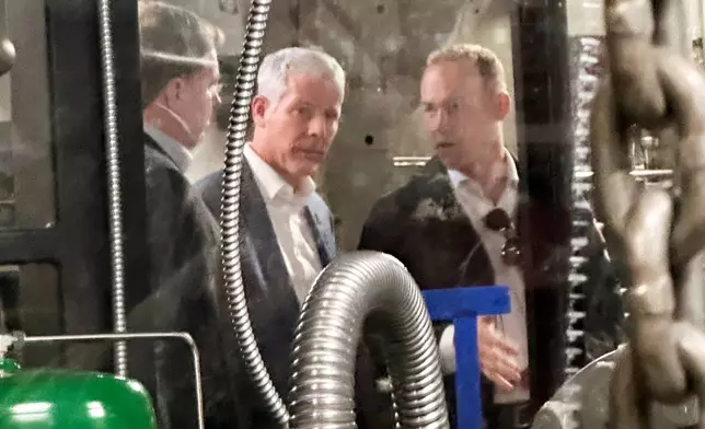 Energy Secretary Chris Wright, center, tours a C-17 military aircraft as a microreactor was transported from March Air Reserve Base, Calif., to Hill Air Force Base in Utah, Sunday ,Feb. 15, 2026. (AP Photo/Matthew Daly)