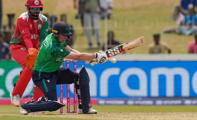 Ireland's Lorcan Tucker plays a shot during the T20 World Cup cricket match between Ireland and Oman in Colombo, Sri Lanka, Saturday, Feb. 14, 2026. (AP Photo/Eranga Jayawardena)