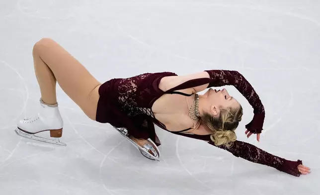 Amber Glenn of the United States competes during the women's short program figure skating at the 2026 Winter Olympics, in Milan, Italy, Tuesday, Feb. 17, 2026. (AP Photo/Ashley Landis)