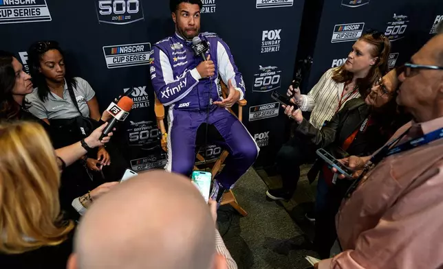 Bubba Wallace speaks during a NASCAR Daytona 500 media day, Wednesday, Feb. 11, 2026, in Daytona, Fla. (AP Photo/Mike Stewart)