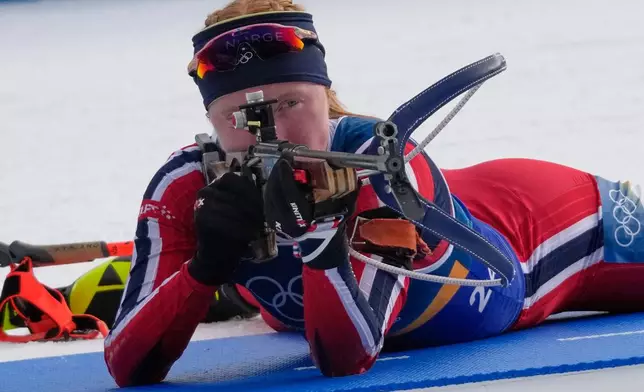 Norway's Maren Kirkeeide shoots during the women's biathlon 4 x 6-kilometers relay race at the 2026 Winter Olympics, in Anterselva, Italy, Wednesday, Feb. 18, 2026. (AP Photo/David J. Phillip)