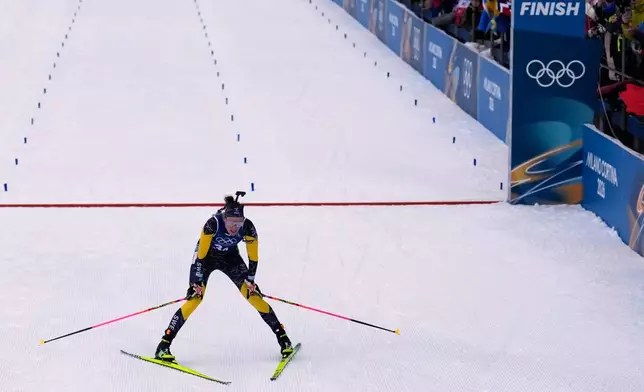 Hanna Oeberg, of Sweden, reacts after winning silver in the women's 4x6-kilometer relay biathlon race at the 2026 Winter Olympics in Anterselva, Italy, Wednesday, Feb. 18, 2026. (AP Photo/Mosa'ab Elshamy)