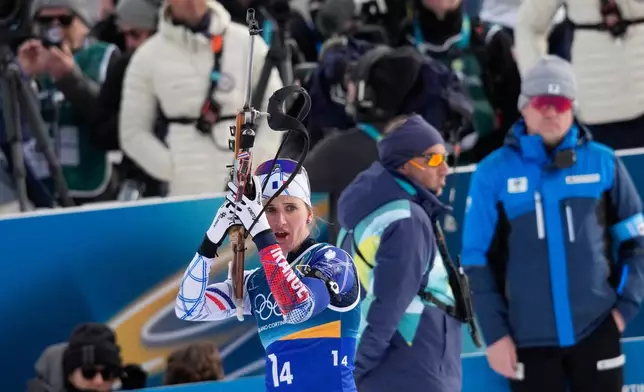 France's Julia Simon prepares to shoot during the women's biathlon 4 x 6-kilometers relay race at the 2026 Winter Olympics, in Anterselva, Italy, Wednesday, Feb. 18, 2026. (AP Photo/David J. Phillip)