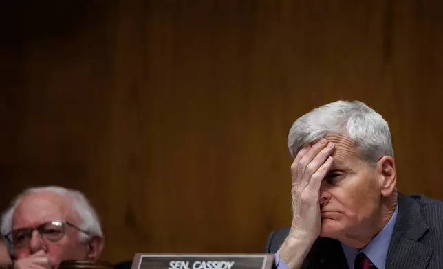 Committee Chair Senator Bill Cassidy R-La. holds his head as Dr. Casey Means testifies during a Senate Health, Education Labor and Pension Committee Conformation Hearing for U.S. Surgeon General on Capitol Hill on Wednesday, Feb. 25, 2026, in Washington. (AP Photo/Tom Brenner)